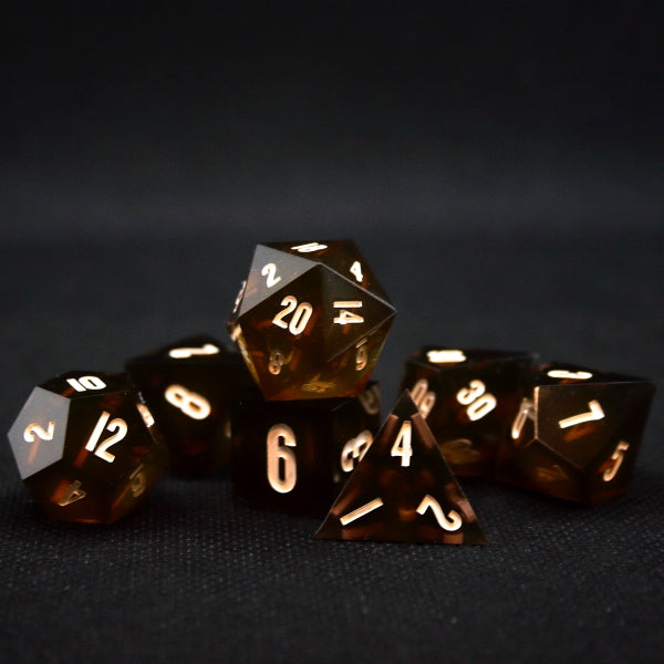 Set of 7 Dice for TTRPGs that look like amber glass.