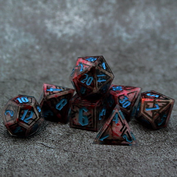 7 piece dr. zed borderlands dice set. White insert, red spattered. Clear shell, teal inked.