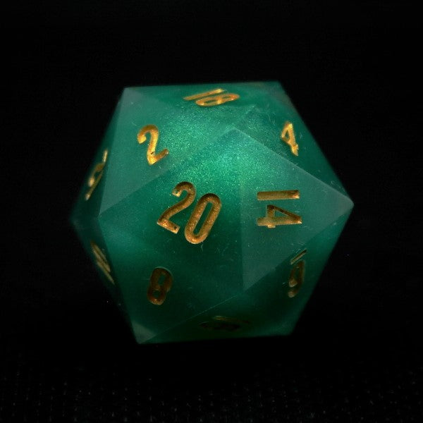 Green sphere core D20 single die. Inked in Gold.