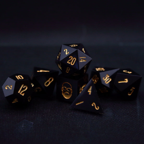 Black TTRPG dice set inked in gold, symbolizing Guy-man of Daft punk