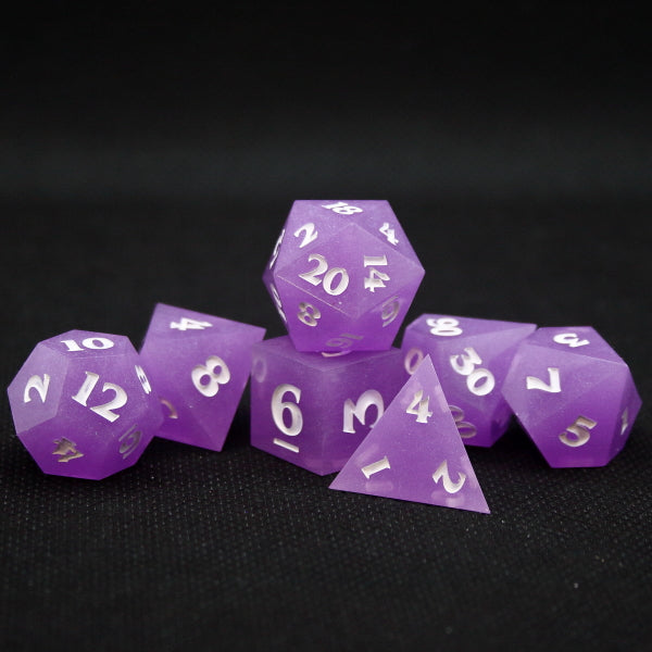 Shimmery Purple Set of TTRPG Dice inked in white.